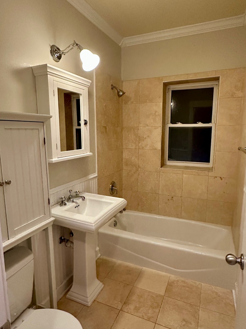 2537.5 Prairie Avenue, Unit 3S Evanston, IL 60201 - Photo 6 of 8 a bathroom with a sink toilet and shower