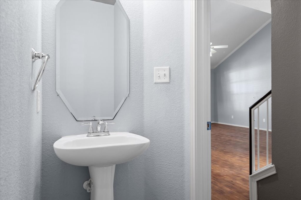 633 Fairway Kyle, TX 78640 - Photo 12 of 22 a bathroom with a sink and a mirror