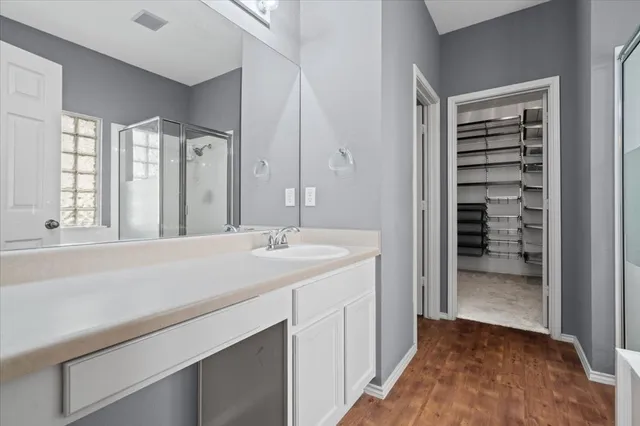 a bathroom with a bathtub and shower