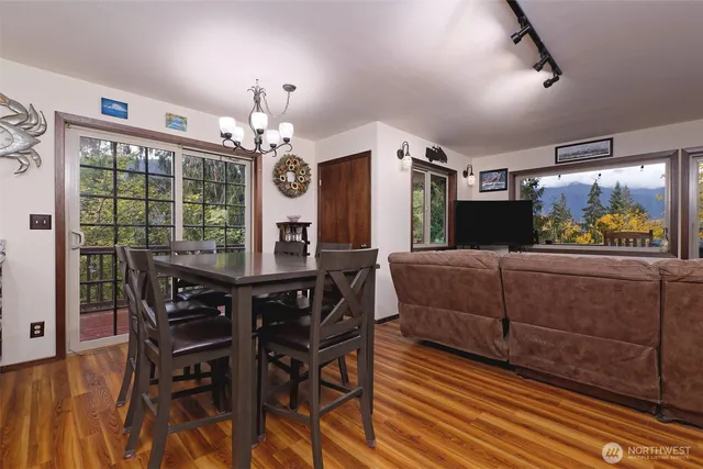 a bathroom with a toilet sink vanity and mirror