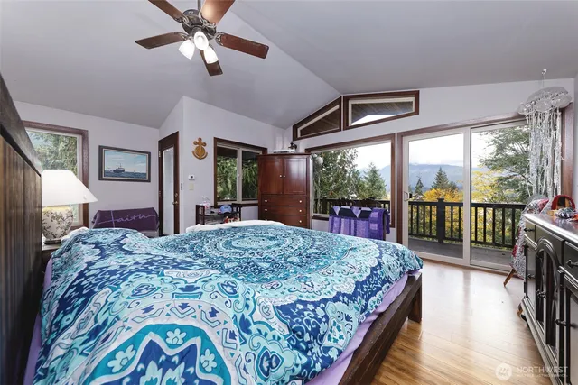 a bed room with a bed and a chandelier