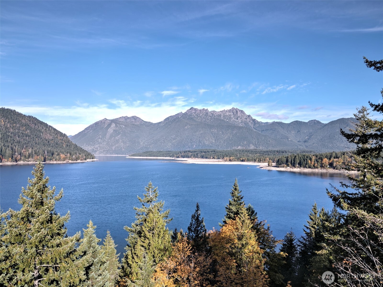 5791 North Lake Cushman Road Hoodsport, WA 98548 - Photo 15 of 39 a view of a lake with mountains in the background