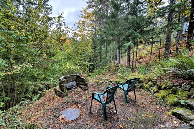 a view of a house with a mountain in the background