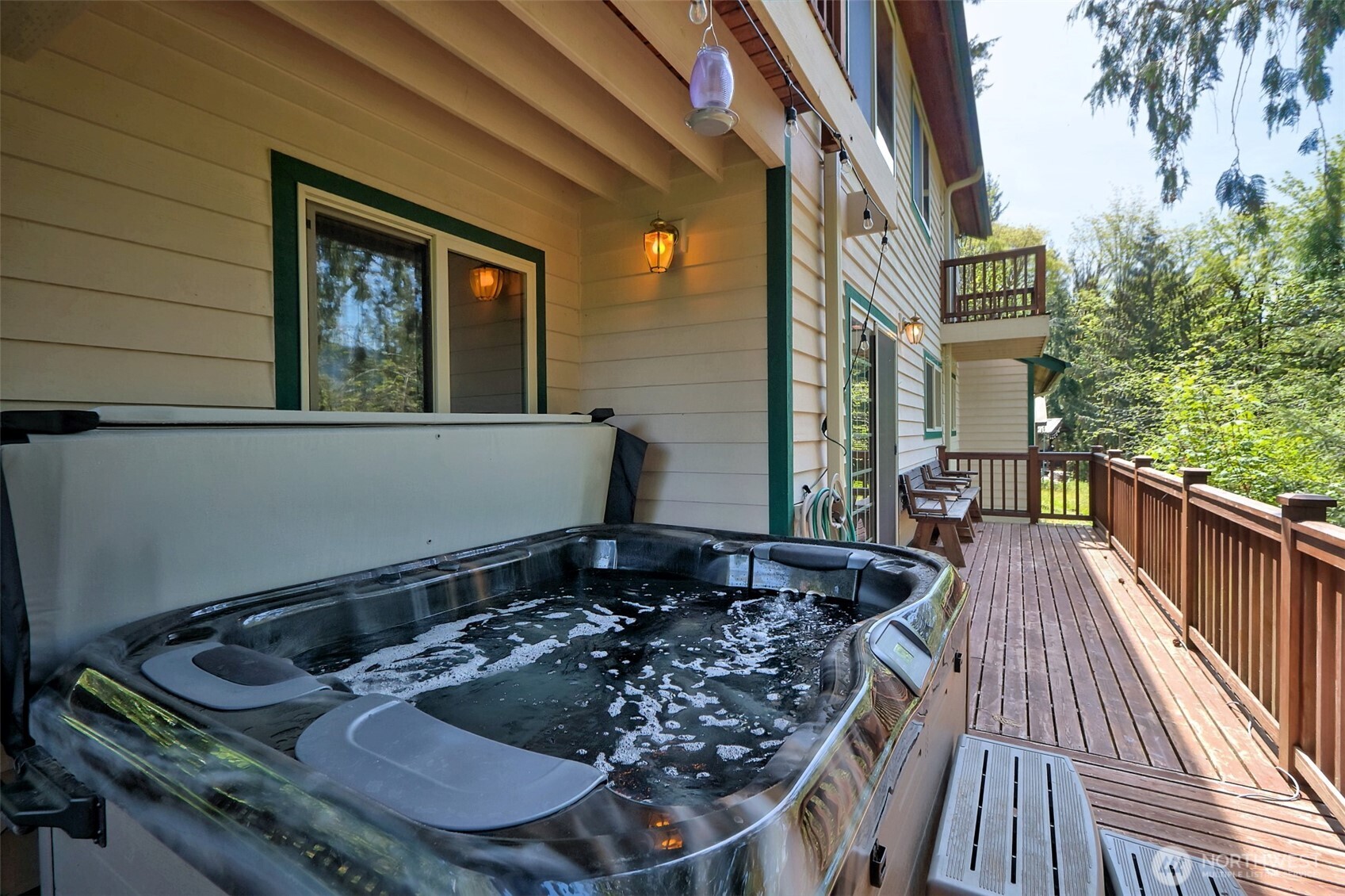 5791 North Lake Cushman Road Hoodsport, WA 98548 - Photo 26 of 39 a table of chairs sitting in front of a house