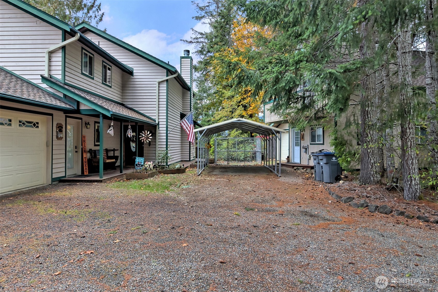 5791 North Lake Cushman Road Hoodsport, WA 98548 - Photo 30 of 39 a view of a house with a yard and large tree