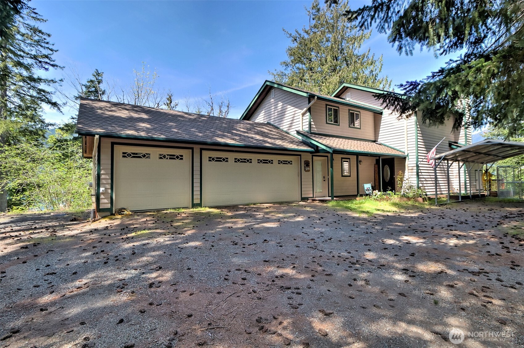 5791 North Lake Cushman Road Hoodsport, WA 98548 - Photo 3 of 39 a view of a house with a yard