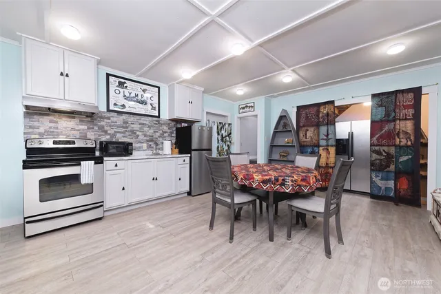 a dining room with furniture and wooden floor