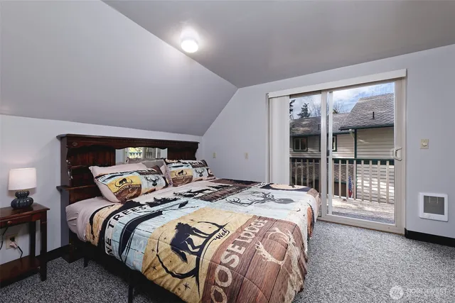 a bedroom with a bed and a couch