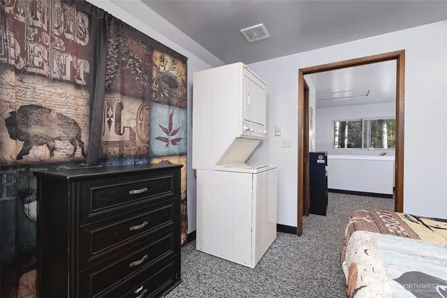 a room with a sink and a mirror