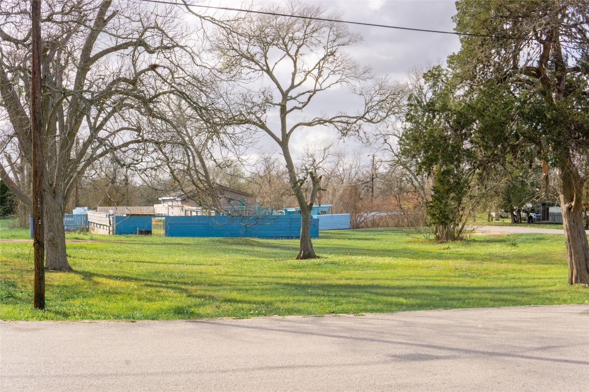 204 3rd Street Rosenberg, TX 77471 - Photo 3 of 7 a big yard with trees in the background