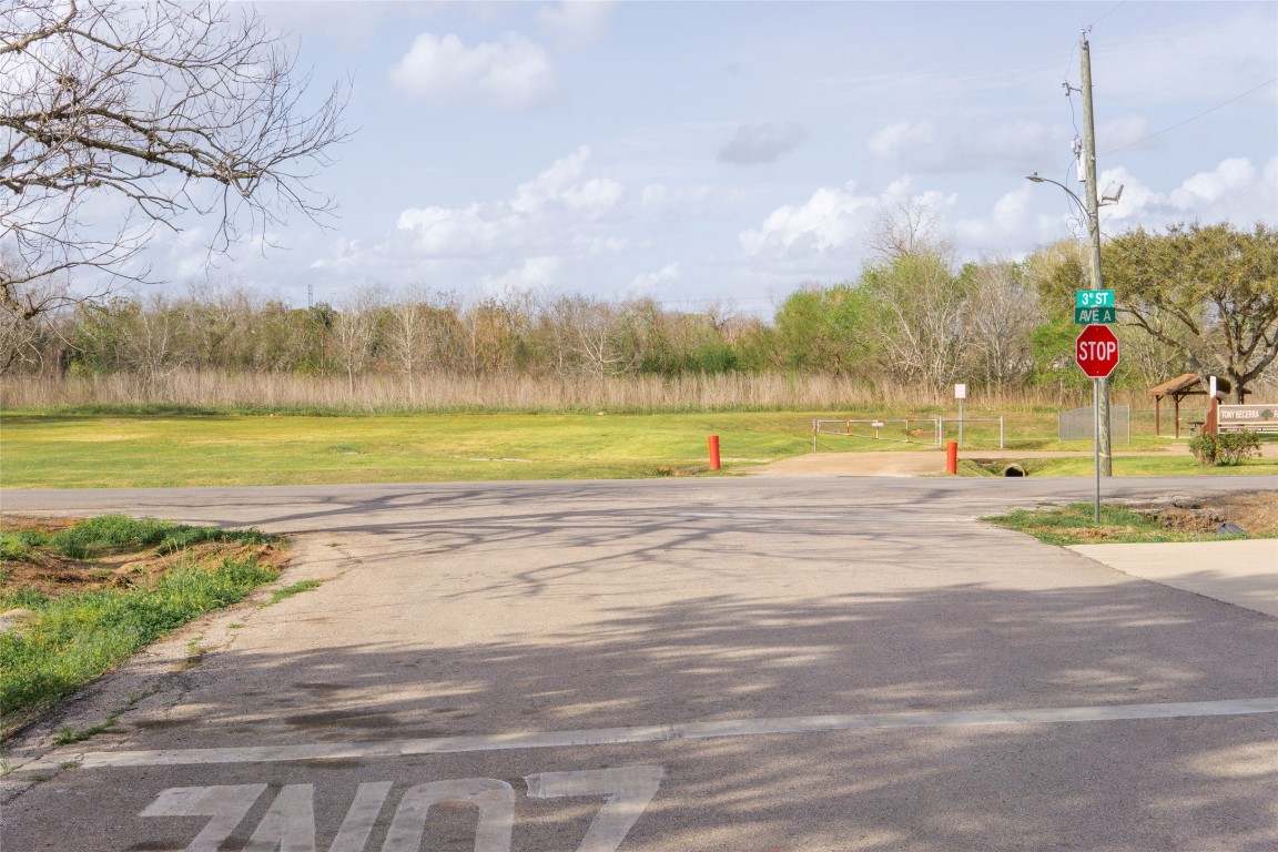 204 3rd Street Rosenberg, TX 77471 - Photo 4 of 7 a view of a lake with a big yard