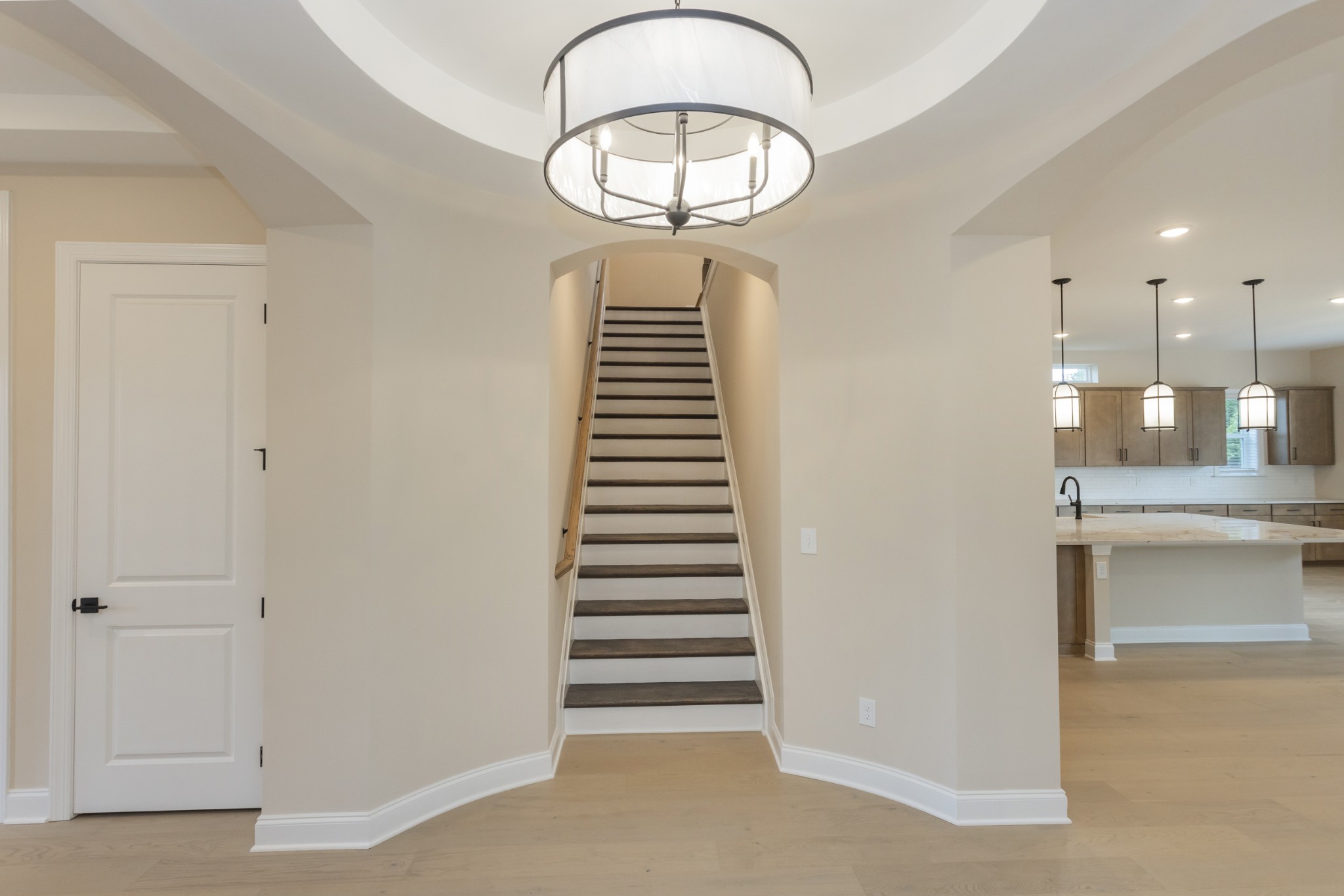 7006 Thunderhead Way Spring Hill, TN 37174 - Photo 11 of 58 a view of a hallway with stairs and a chandelier