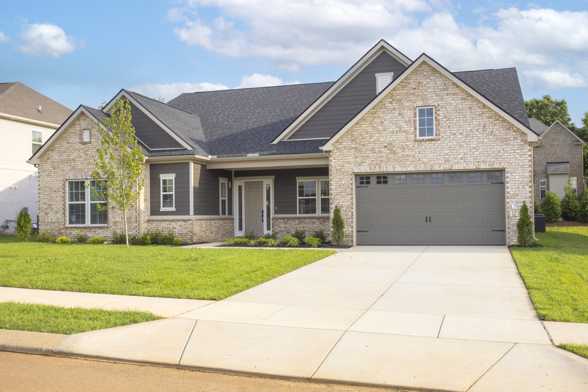 7006 Thunderhead Way Spring Hill, TN 37174 - Photo 2 of 58 a front view of a house with a yard and garage