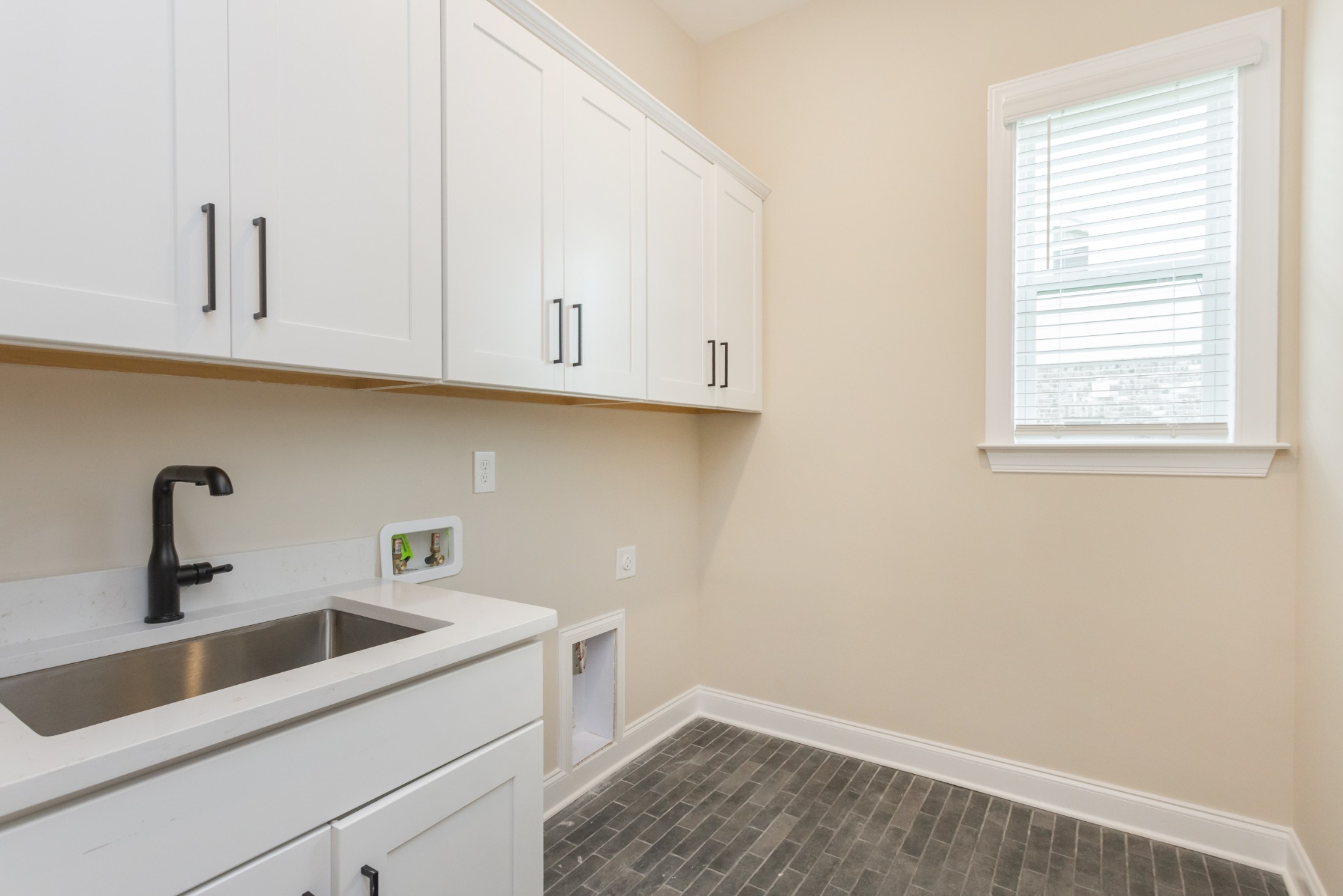 7006 Thunderhead Way Spring Hill, TN 37174 - Photo 34 of 58 a view of a kitchen sink and cabinets