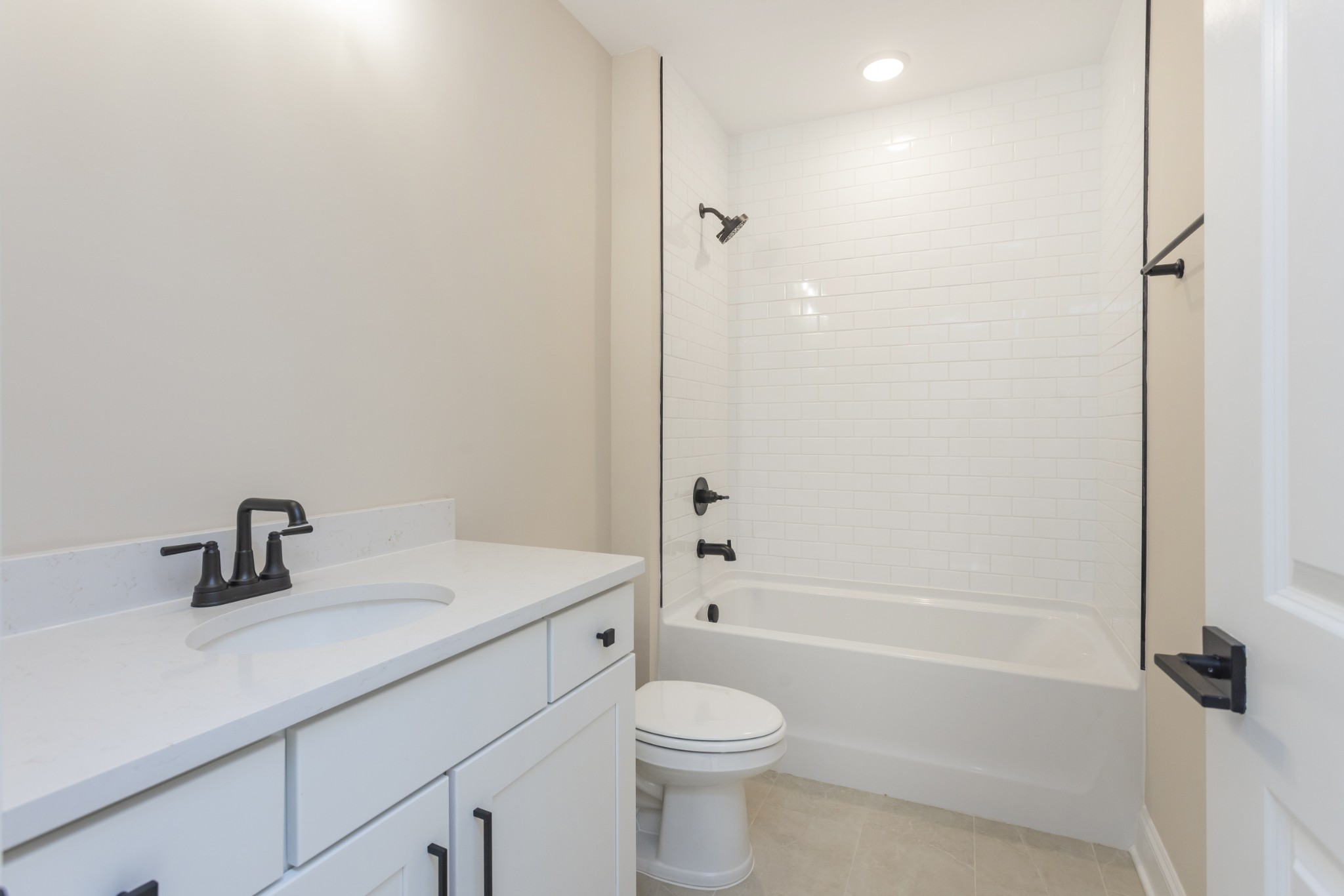 7006 Thunderhead Way Spring Hill, TN 37174 - Photo 49 of 58 a bathroom with a sink a toilet and shower