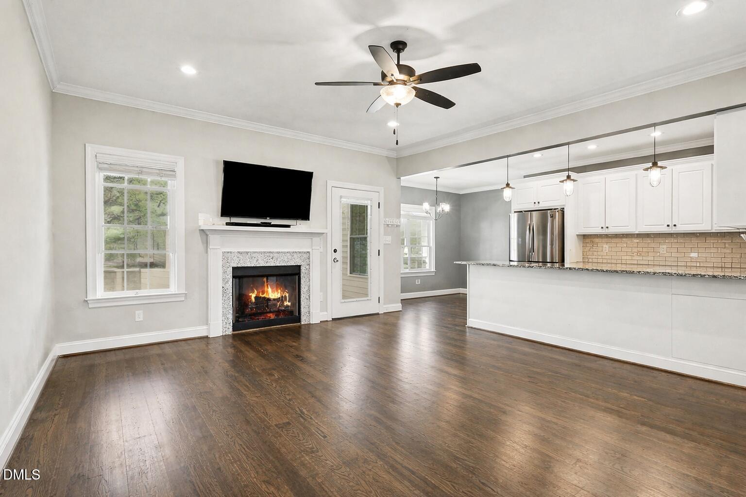 5117 Joe Ellen Road Battleboro, NC 27809 - Photo 6 of 23 a view of a livingroom with a fireplace a window and a fireplace