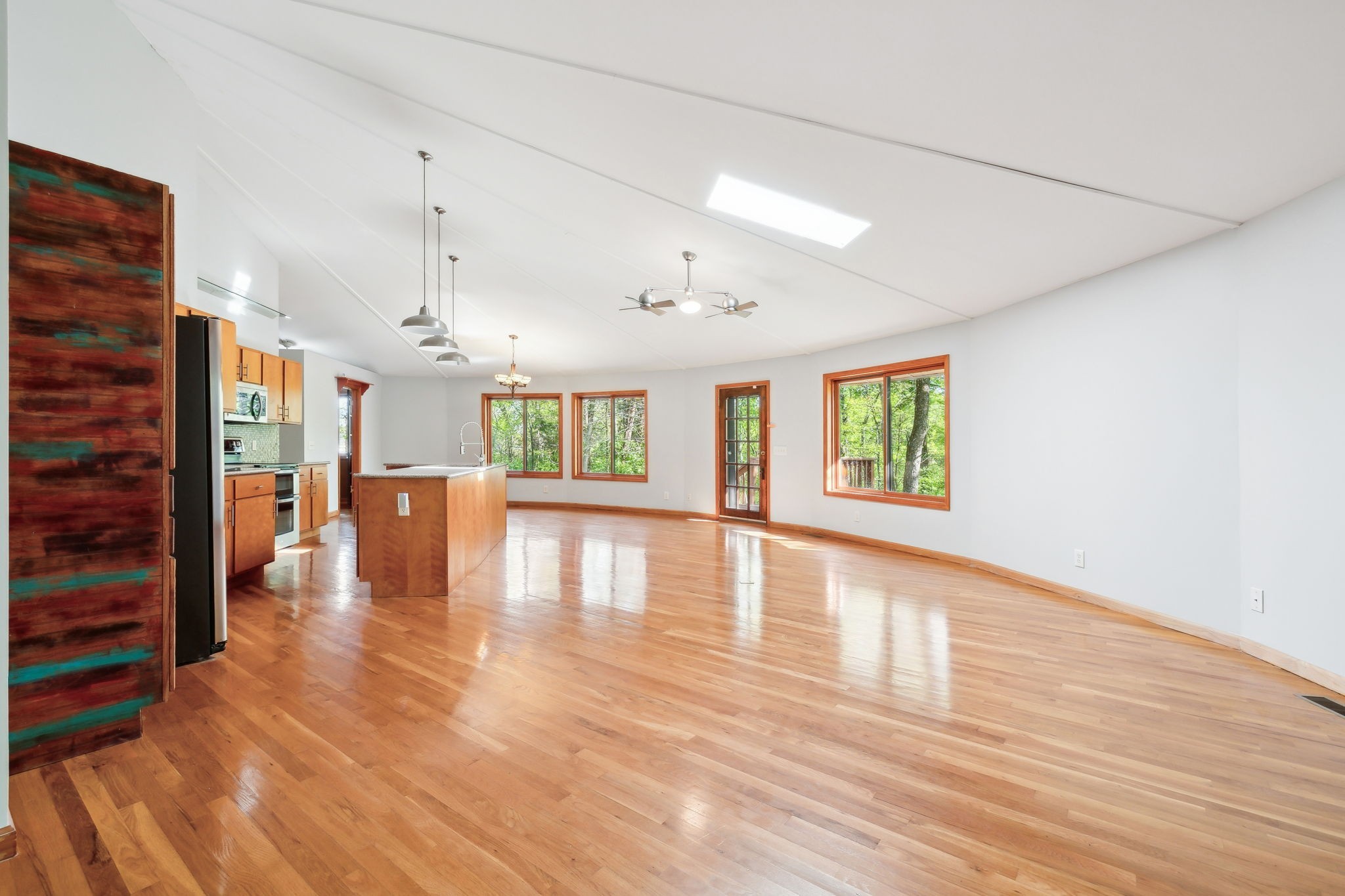 3055 Smith Springs Road Antioch, TN 37013 - Photo 11 of 59 a view of an empty room with wooden floor and a window