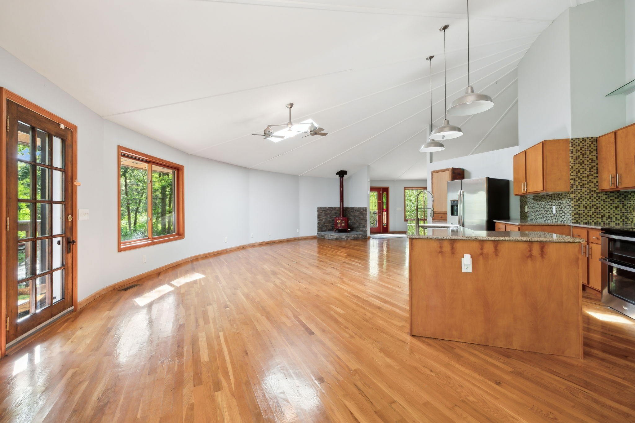 3055 Smith Springs Road Antioch, TN 37013 - Photo 17 of 59 a living room with stainless steel appliances kitchen island wooden floors and large window