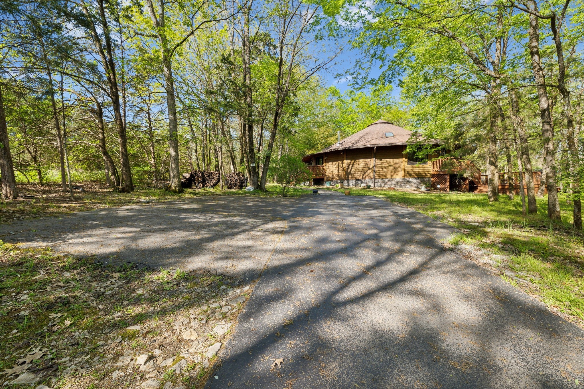 3055 Smith Springs Road Antioch, TN 37013 - Photo 50 of 59 a backyard of a house with table and chairs under an umbrella