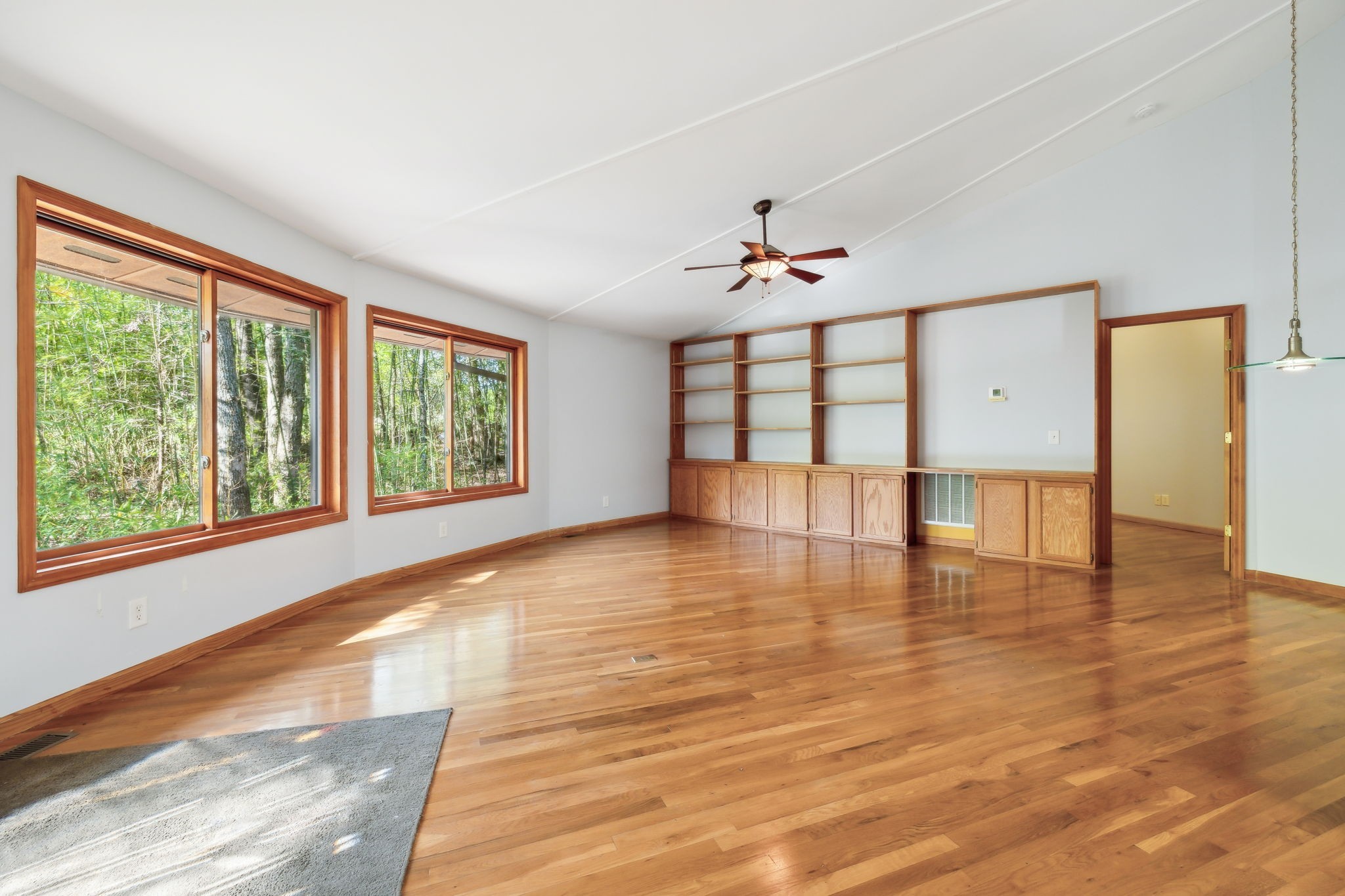 3055 Smith Springs Road Antioch, TN 37013 - Photo 7 of 59 a view of an empty room with a window and wooden floor