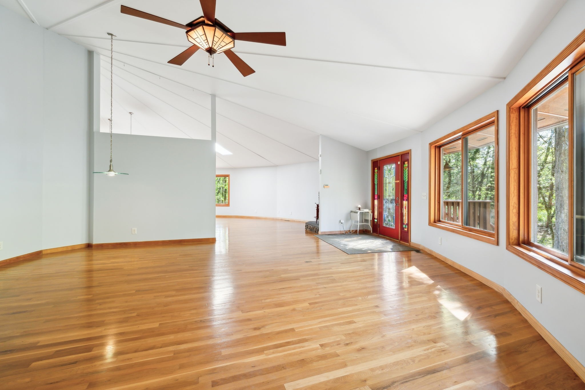 3055 Smith Springs Road Antioch, TN 37013 - Photo 8 of 59 a view of an empty room with window and wooden floor