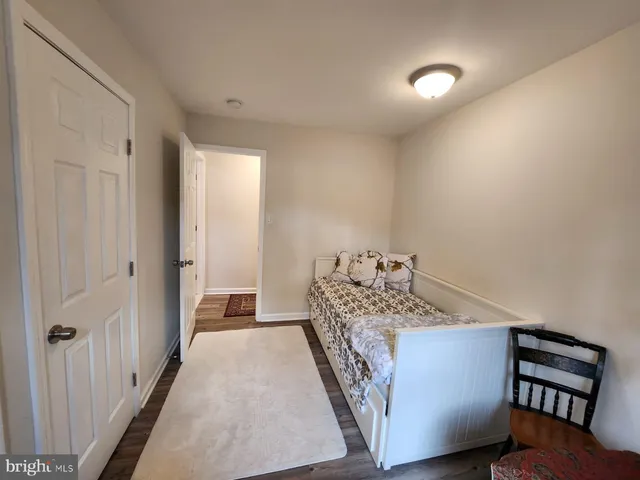 a bedroom with a bed and a closet