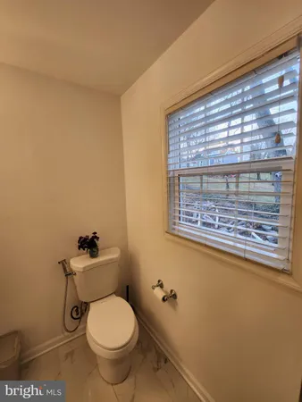 a bathroom with a toilet and a sink