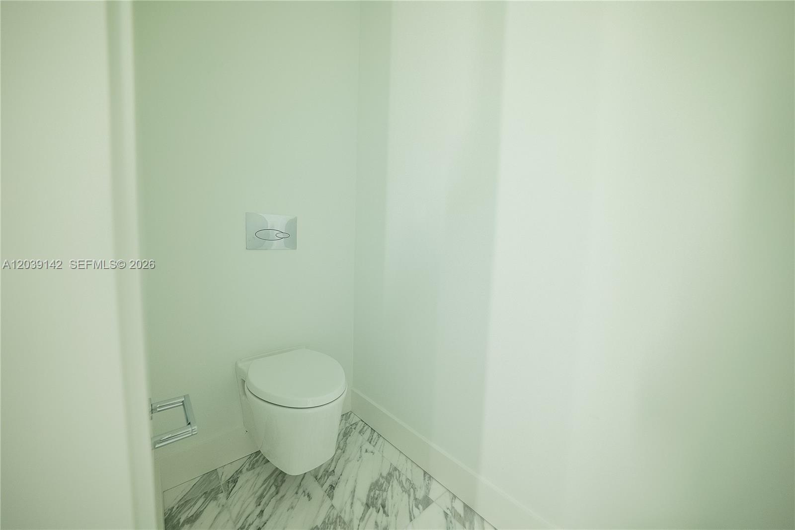 175 Southeast 25th Road, Unit 702 Miami, FL 33129 - Photo 9 of 30 a bathroom with a toilet and a sink