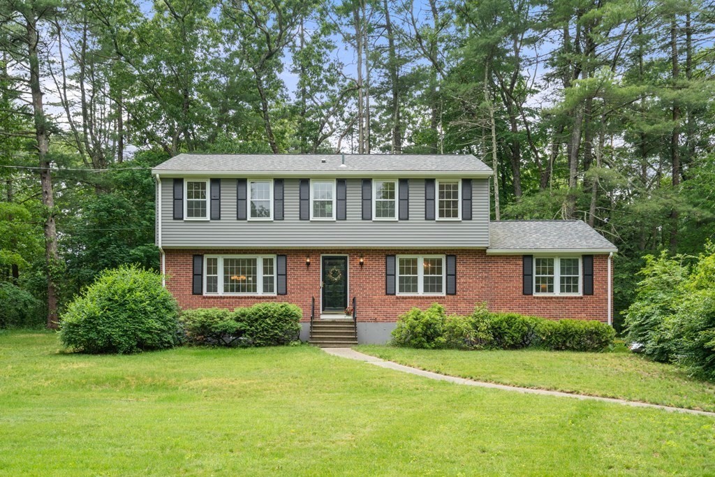 5 Parmenter Road Sudbury, MA 01776 - Photo 1 of 33 a front view of a house with a garden