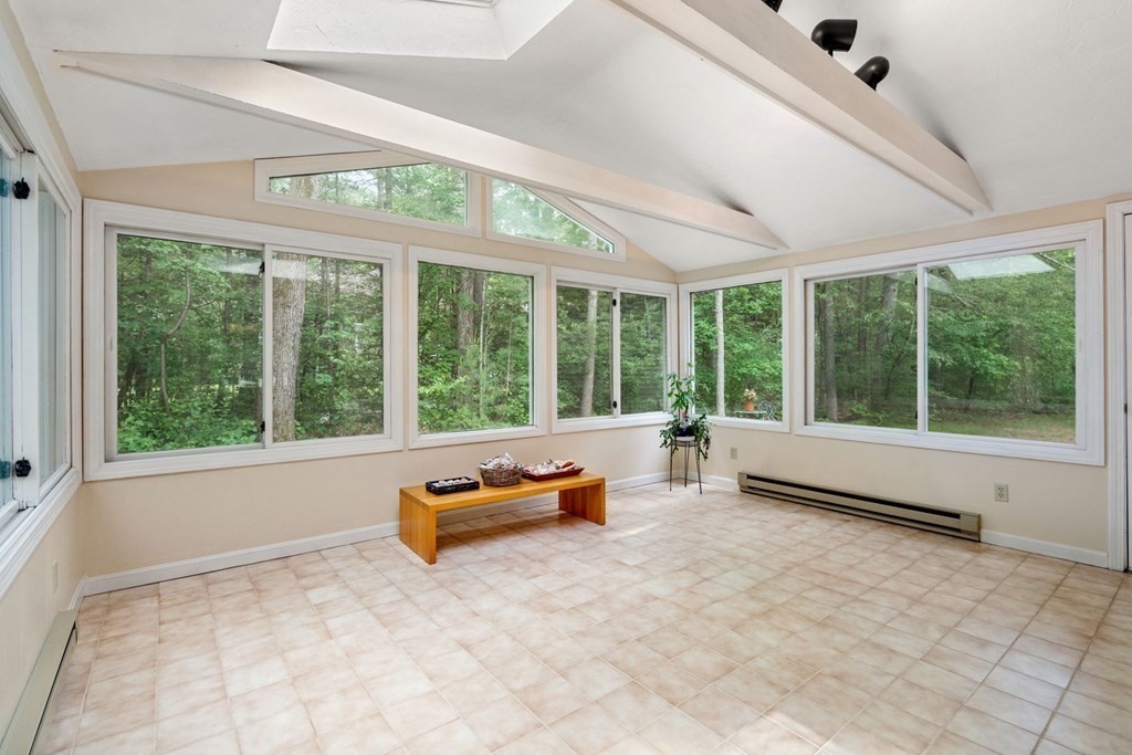 5 Parmenter Road Sudbury, MA 01776 - Photo 14 of 33 a view of an empty room with wooden floor and iron stairs