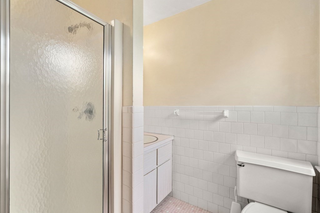 5 Parmenter Road Sudbury, MA 01776 - Photo 17 of 33 a bathroom with a shower and a toilet