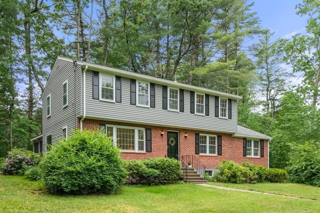 5 Parmenter Road Sudbury, MA 01776 - Photo 24 of 33 a front view of a house with a yard