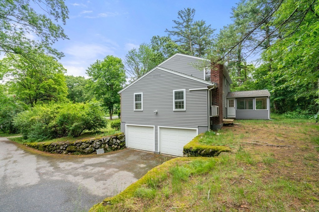 5 Parmenter Road Sudbury, MA 01776 - Photo 26 of 33 a backyard of a house with plants and tree