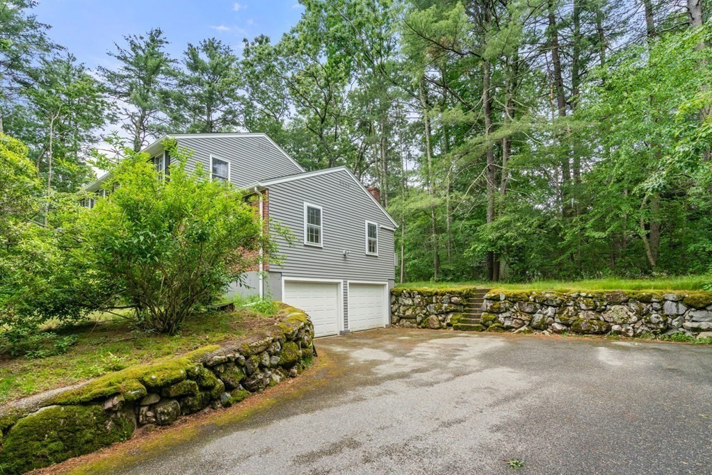 5 Parmenter Road Sudbury, MA 01776 - Photo 29 of 33 a front view of a house with a yard