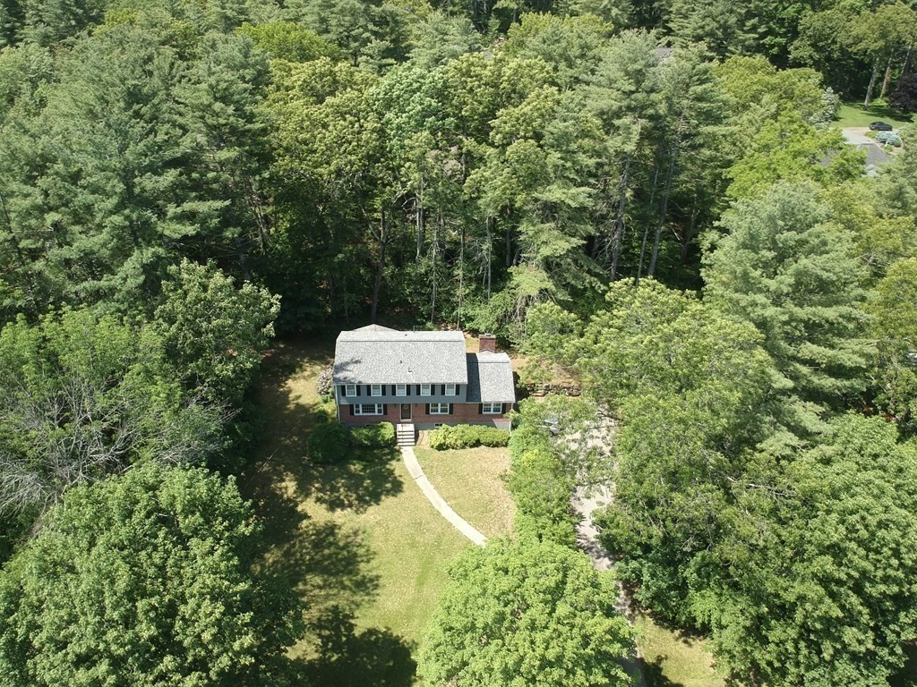 5 Parmenter Road Sudbury, MA 01776 - Photo 30 of 33 an aerial view of a house with a yard fountain and large trees
