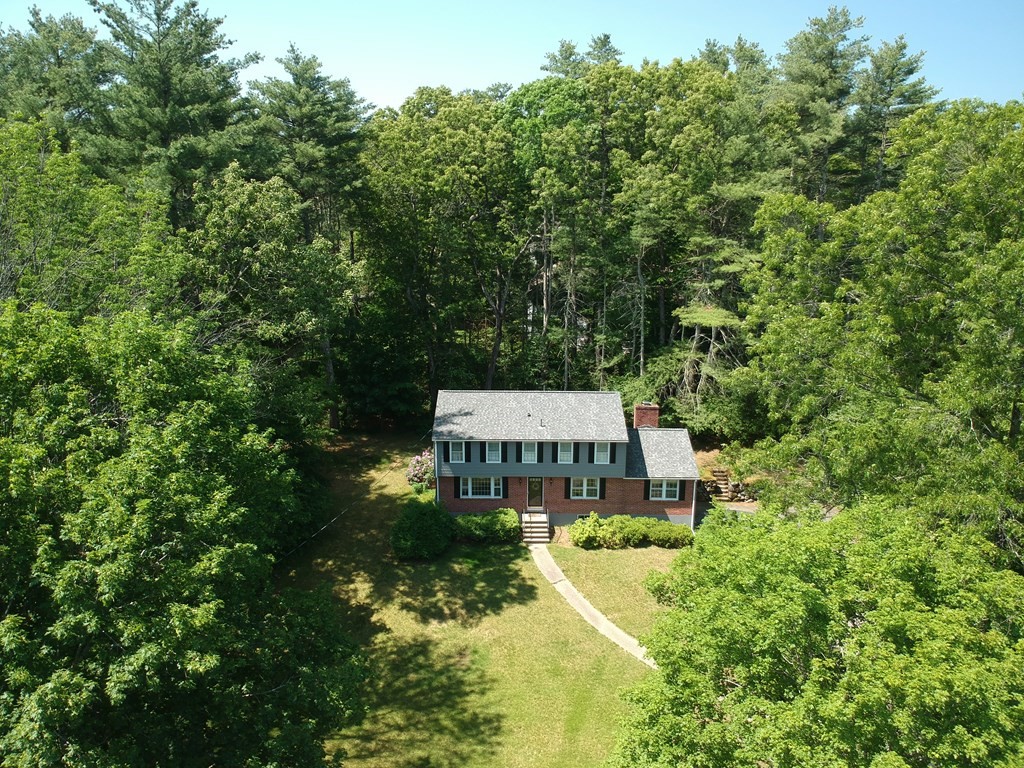 5 Parmenter Road Sudbury, MA 01776 - Photo 3 of 33 a view of a big house with large trees and plants