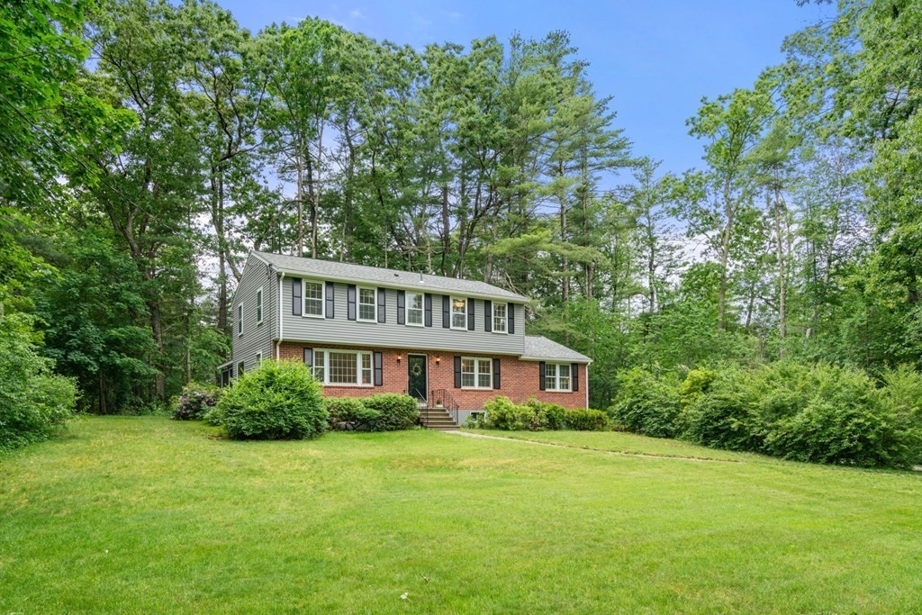 5 Parmenter Road Sudbury, MA 01776 - Photo 32 of 33 a front view of a house with a garden