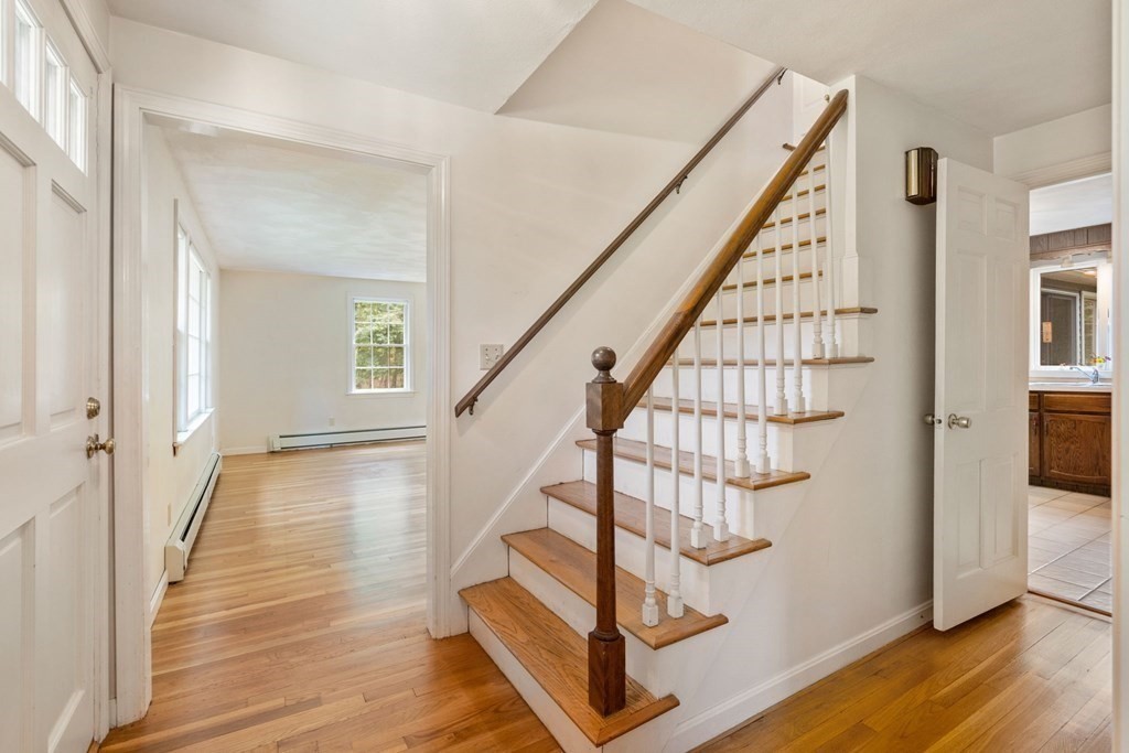 5 Parmenter Road Sudbury, MA 01776 - Photo 10 of 33 a view of entryway with wooden floor and stairs