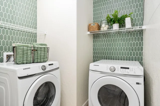 a utility room with dryer and washer