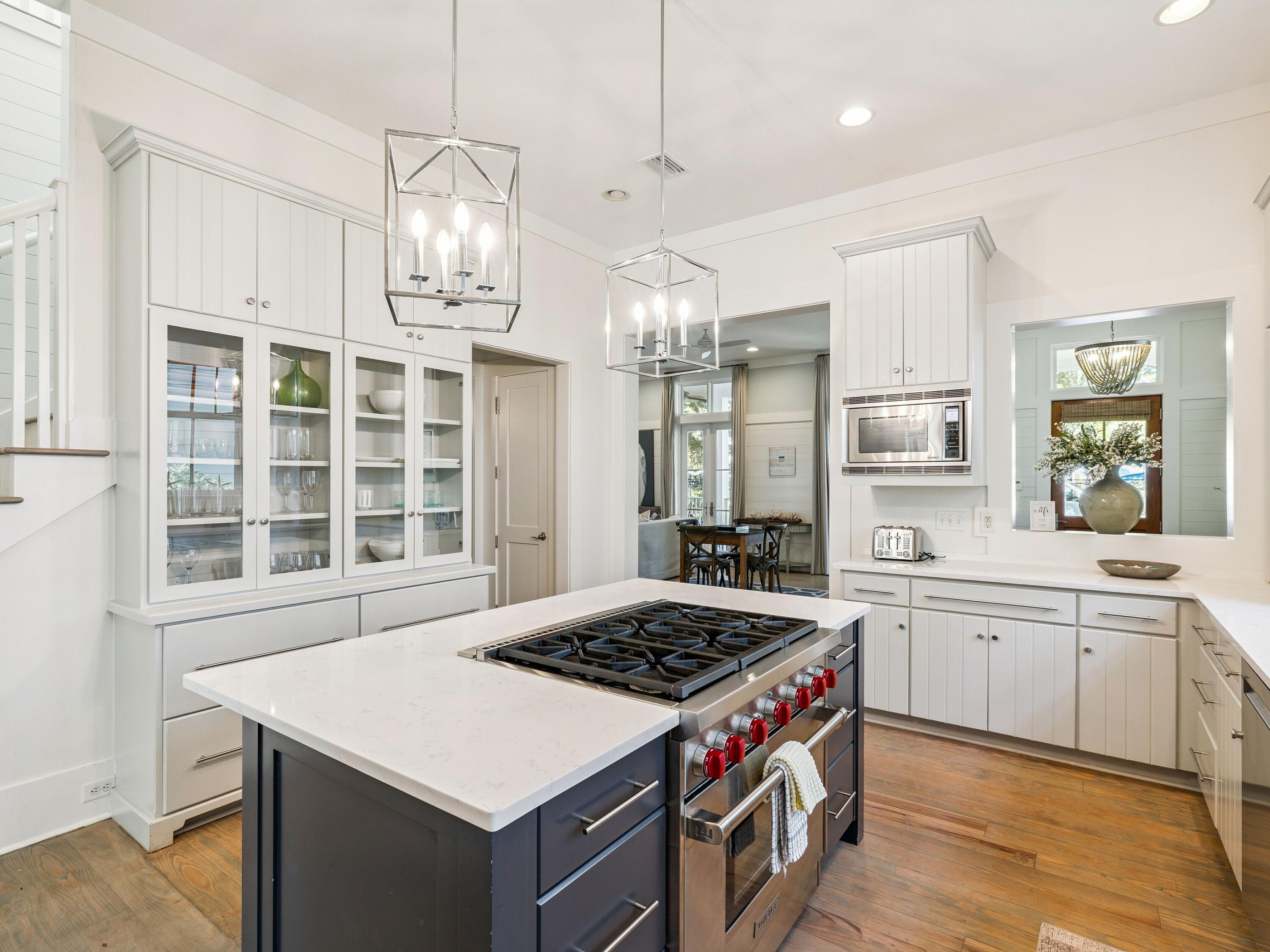 134 Spartina Circle Santa Rosa Beach, FL 32459 - Photo 15 of 41 a kitchen that has a sink a stove and a wooden floors