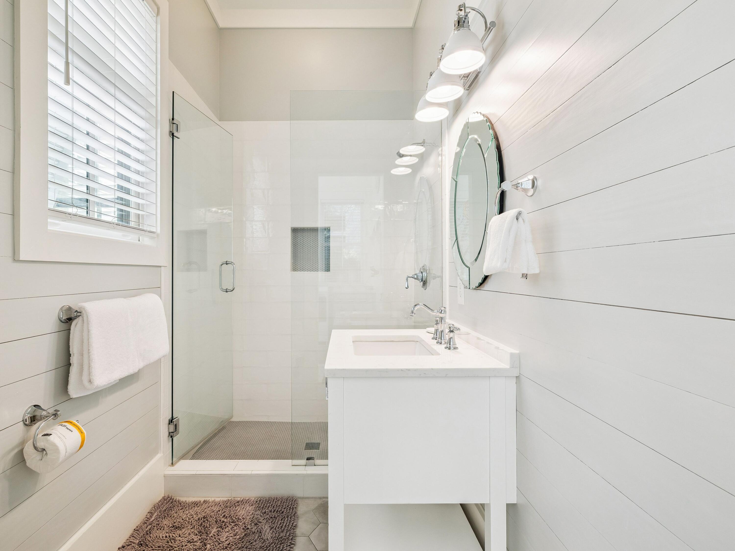 134 Spartina Circle Santa Rosa Beach, FL 32459 - Photo 20 of 41 a bathroom with a sink a toilet and mirror