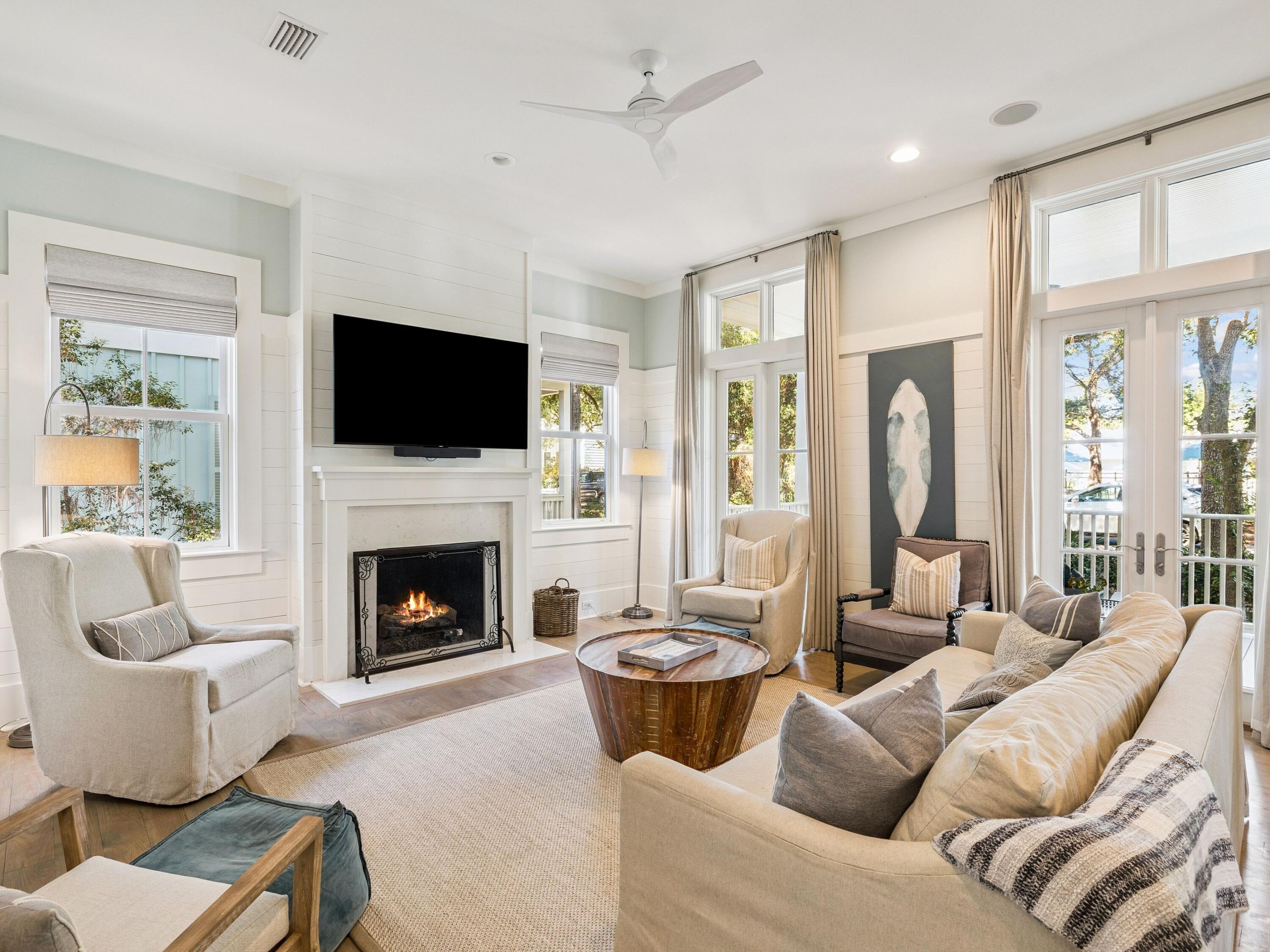 134 Spartina Circle Santa Rosa Beach, FL 32459 - Photo 2 of 41 a living room with furniture a fireplace and a flat screen tv