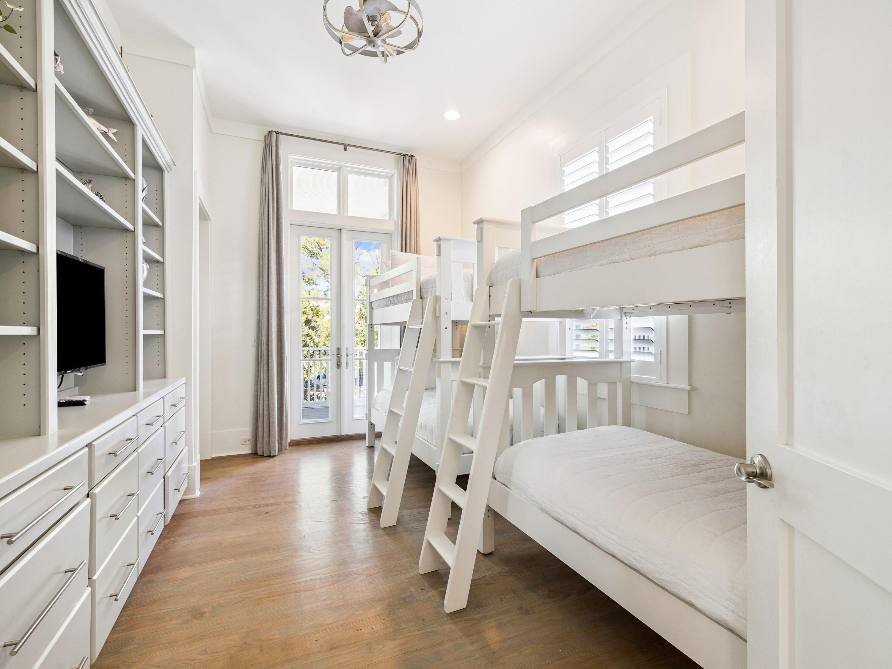134 Spartina Circle Santa Rosa Beach, FL 32459 - Photo 22 of 41 a spacious bedroom with a bed and a flat screen tv