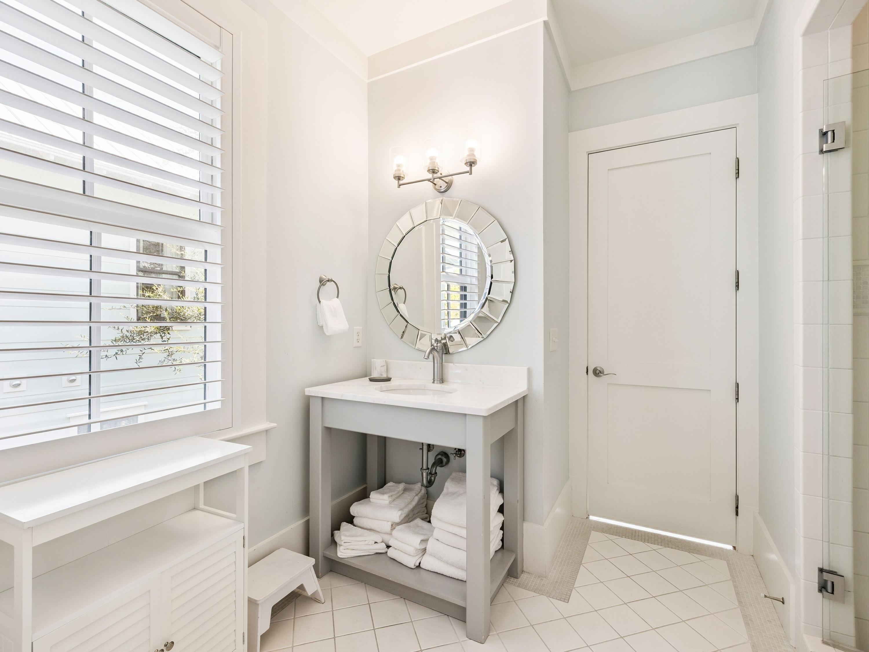 134 Spartina Circle Santa Rosa Beach, FL 32459 - Photo 24 of 41 a bathroom with a sink a mirror and a window