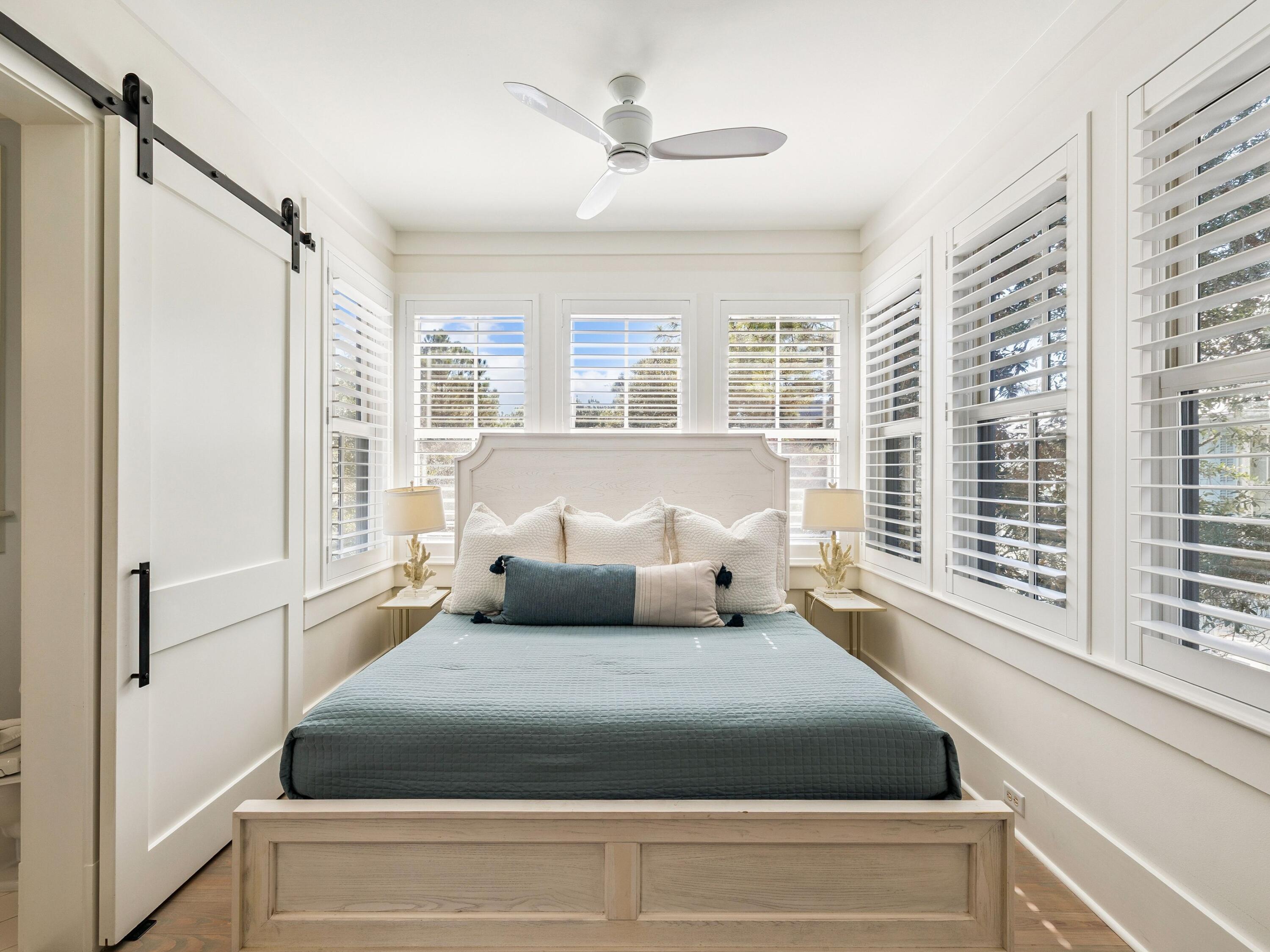 134 Spartina Circle Santa Rosa Beach, FL 32459 - Photo 32 of 41 a bedroom with a large bed and a large window with outer view