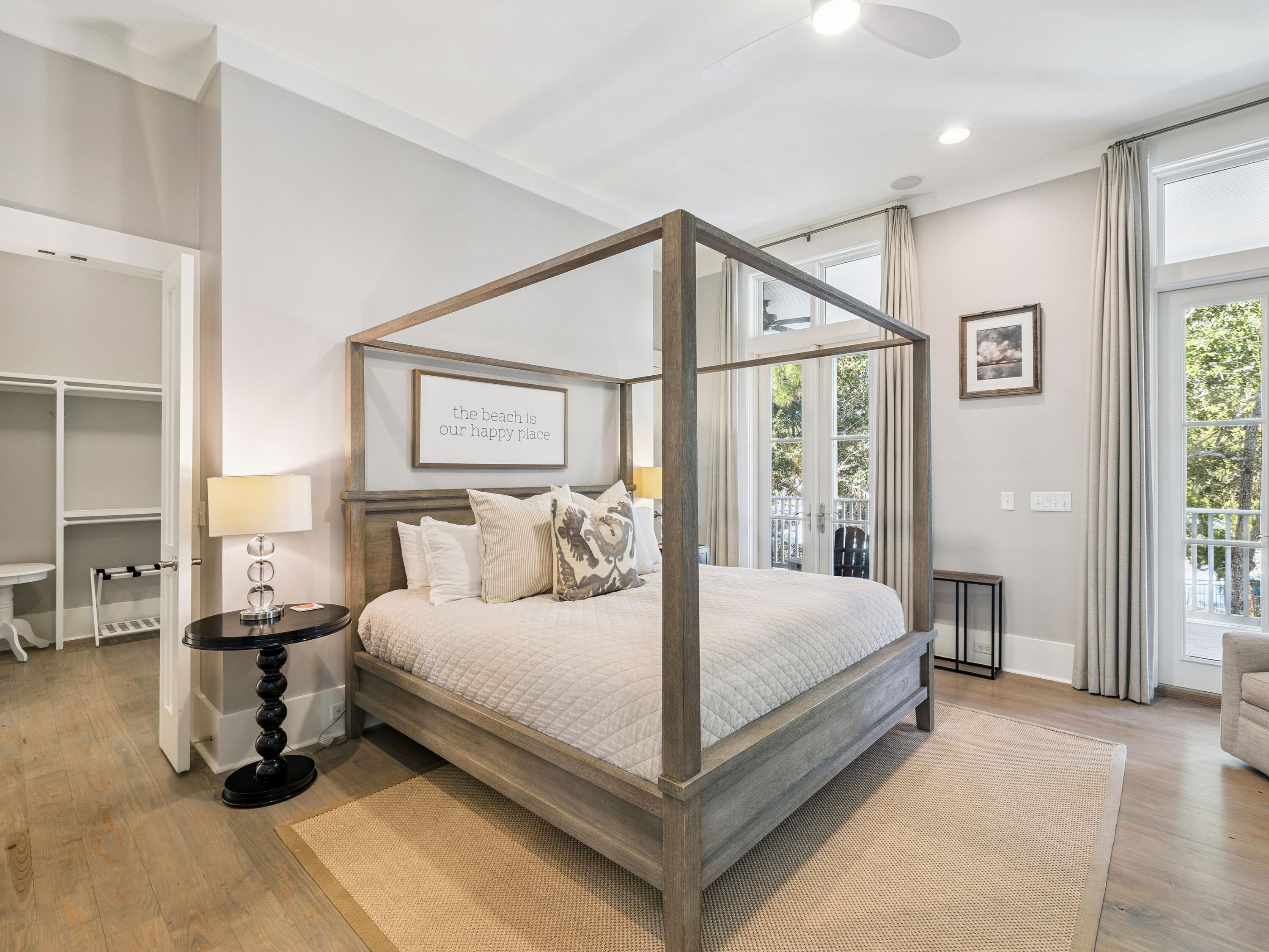 134 Spartina Circle Santa Rosa Beach, FL 32459 - Photo 6 of 41 a bedroom with a large bed and a chandelier