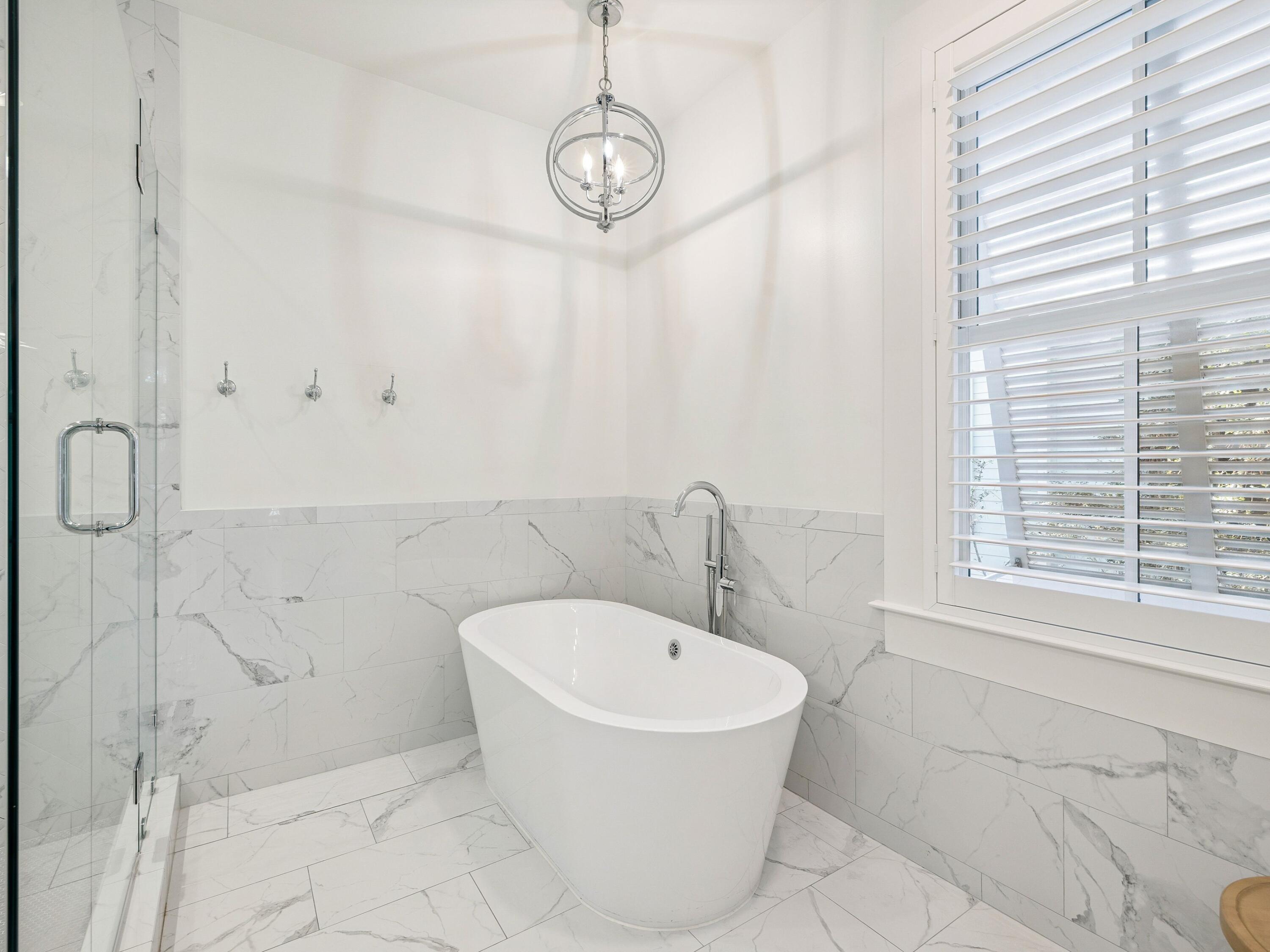 134 Spartina Circle Santa Rosa Beach, FL 32459 - Photo 7 of 41 a bathroom with a bathtub and next to a window