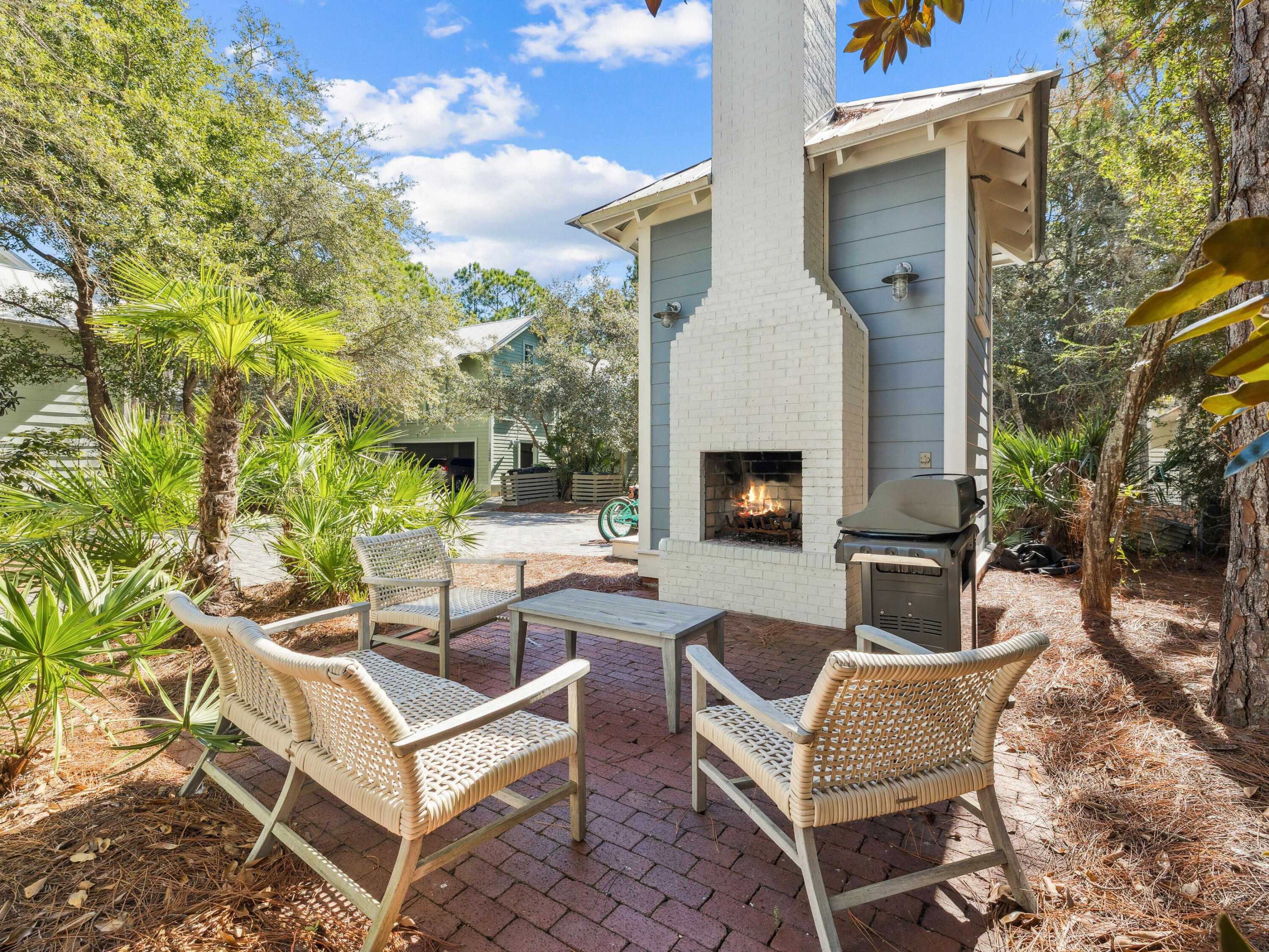 134 Spartina Circle Santa Rosa Beach, FL 32459 - Photo 8 of 41 a view of a patio with couches table and chairs with potted plants