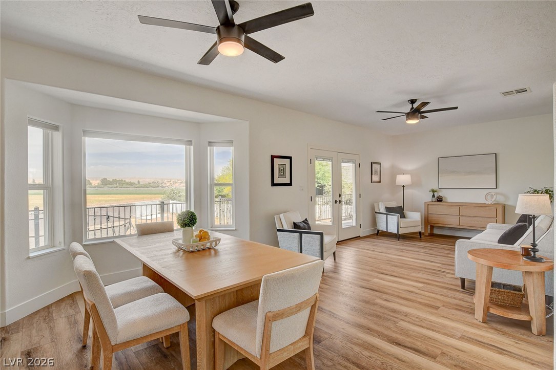 4362 Thistle Street Logandale, NV 89021 - Photo 17 of 99 An open concept living and dining area with beautiful LVP flooring and expansive views.