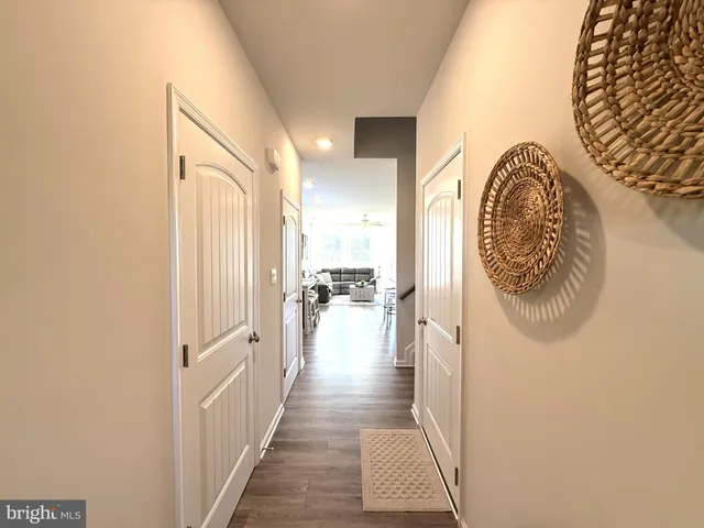 a large kitchen with a table and chairs